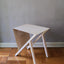 Mesa Pliego en acero con vidrio templado, estilo minimalista.